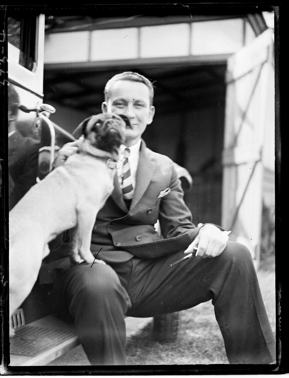 black and white photo of a man and a dog