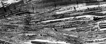 Black and white aerial photo of railyard
