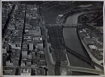 black and white aerial view of flinders street station and rail yards