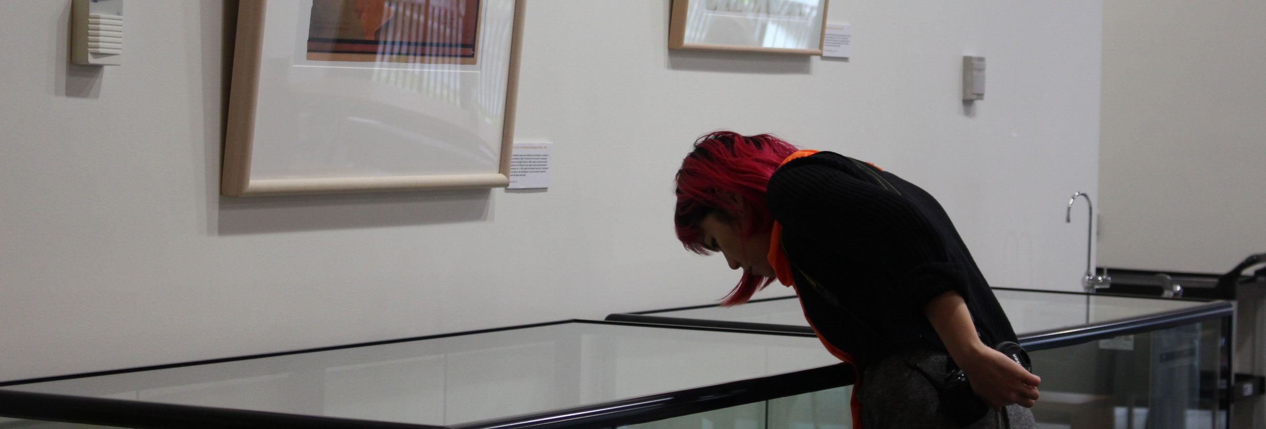 A woman looking at an exhibition