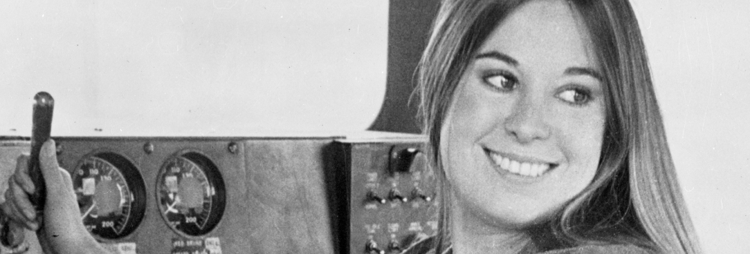 Black and white photo of 1970s train conductor