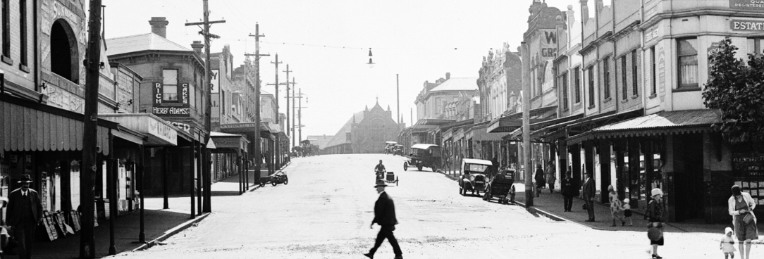Black and white photo of a suburban street