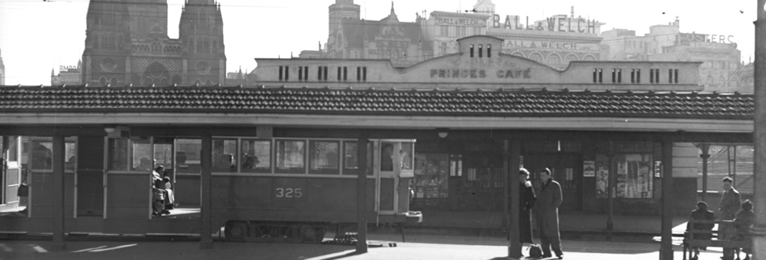 Black and white photo of a tram at a terminus