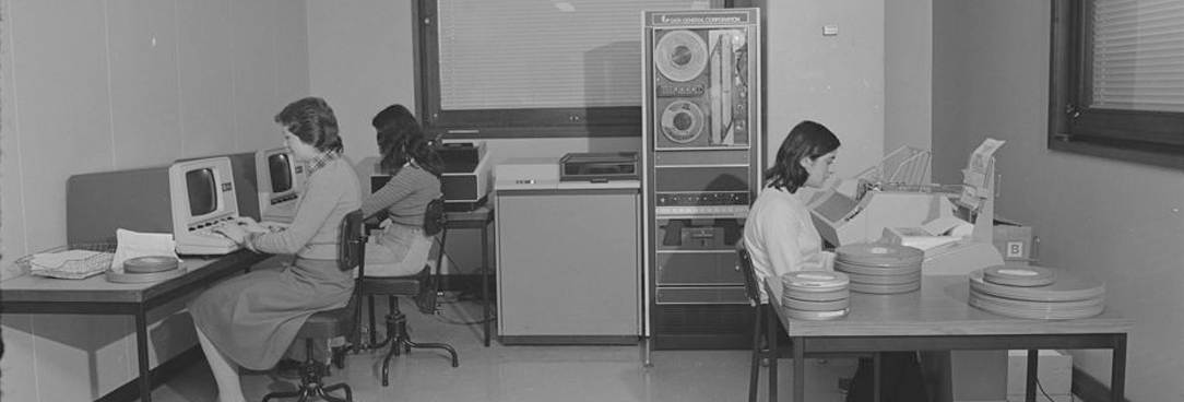 women working at old fashioned computers
