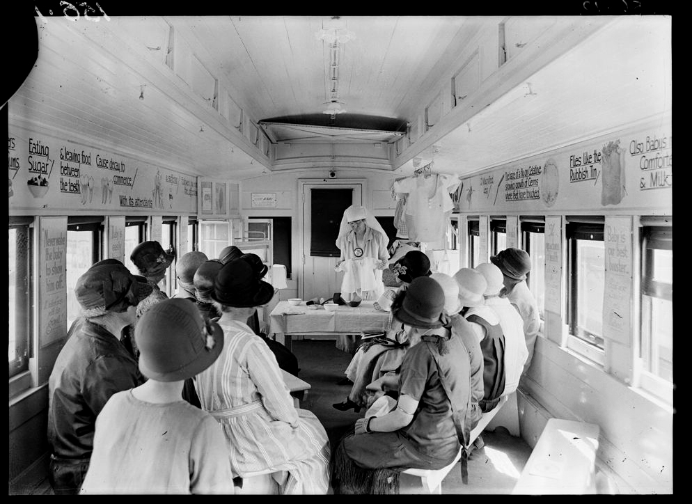 Black and white photograph of women in the 'Better Framing Train' in the 1930s.