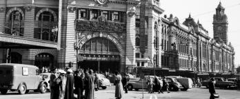 A black and white photo of Flinders Street Station in 1954