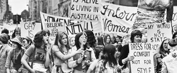 Black and white photo of a women's rights protest in 1975