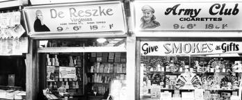 black and white photo of an old canteen kiosk with cigarettes on sale