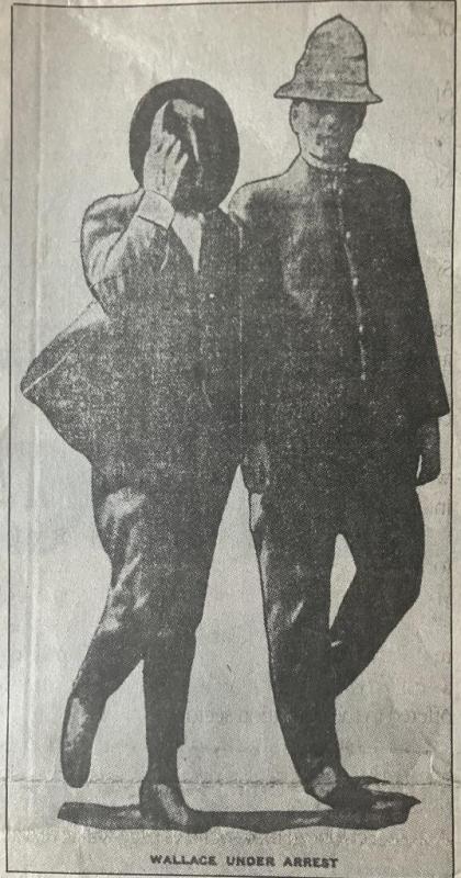 newspaper photo of a police man with a man holding a hat over his face