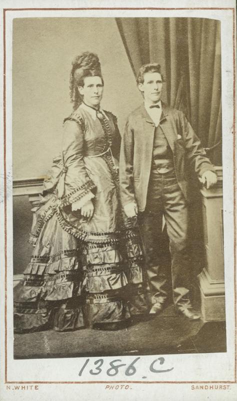 image of two people one in a dress and one in pants