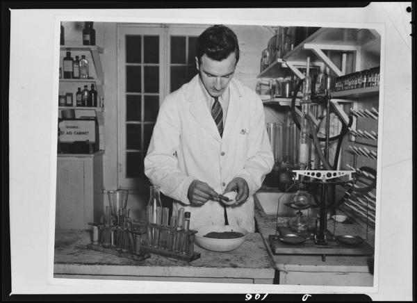 a pharmacist mixing medication