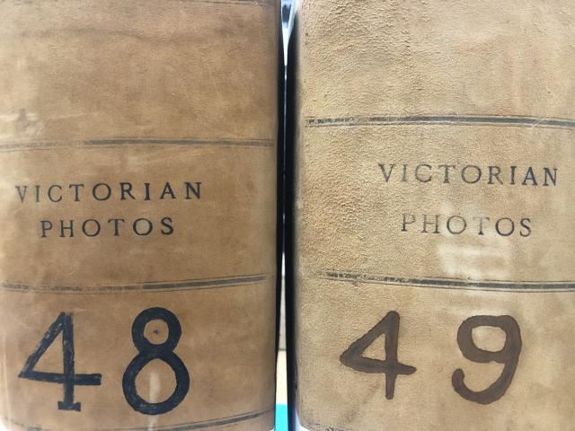 spines of two large books labeled Victorian Photos