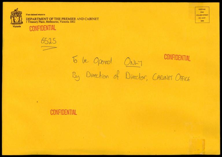 Yellow envelope with confidential stamps across the front. Handwritten text says To be opened only by direction of director, cabinet office