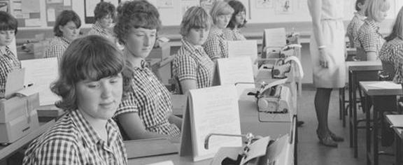 a classroom of women writing